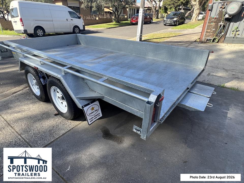 12x6 dual axle trailer with heavy duty loading ramps stored securely beneath the deck
