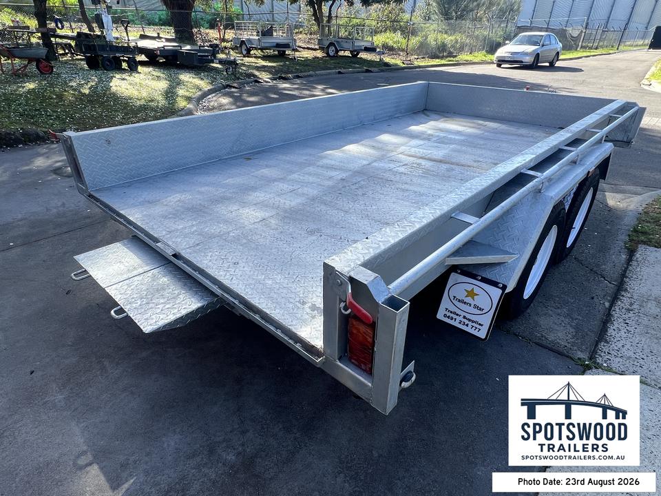12x6 galvanised trailer rear side view showing flat deck and under-deck loading ramp storage