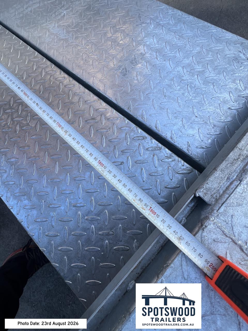 Detailed measurement of checkerplate loading ramp used with The Deckhand 12x6 trailer