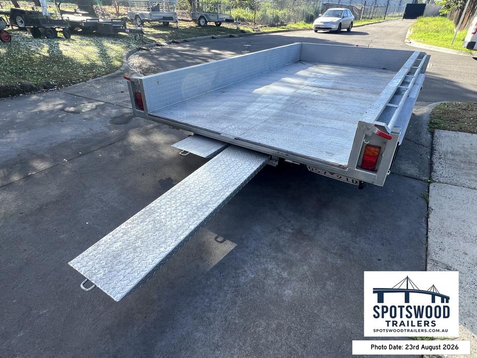 Heavy duty checkerplate loading ramp deployed from The Deckhand 12x6 trailer
