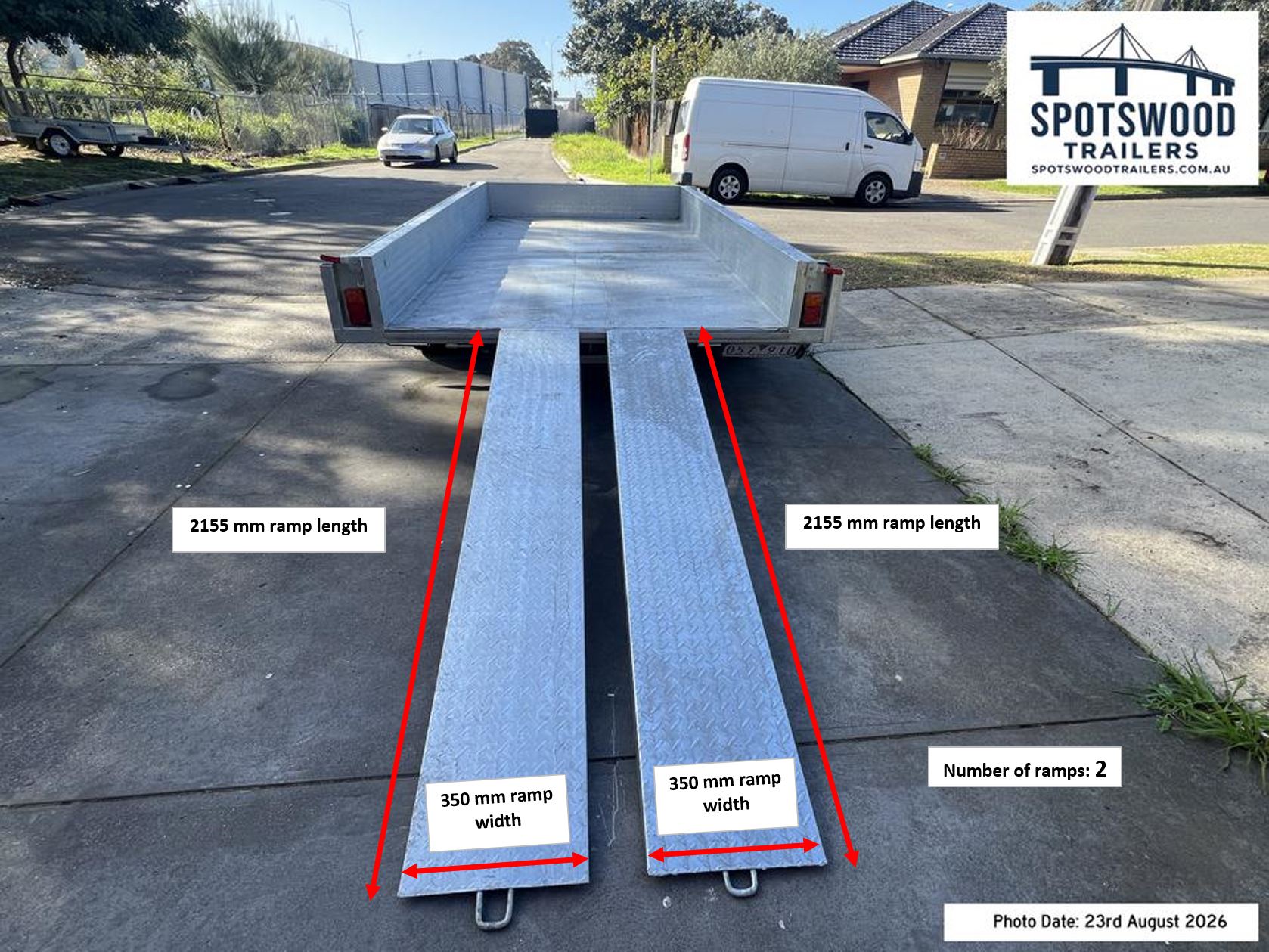 Measurements highlighting the rear view of 12x6 trailer with twin heavy duty loading ramps deployed for machinery loading