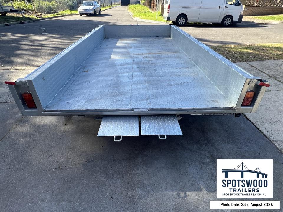 The Deckhand 12x6 trailer loading ramps stored underneath the flat-top deck