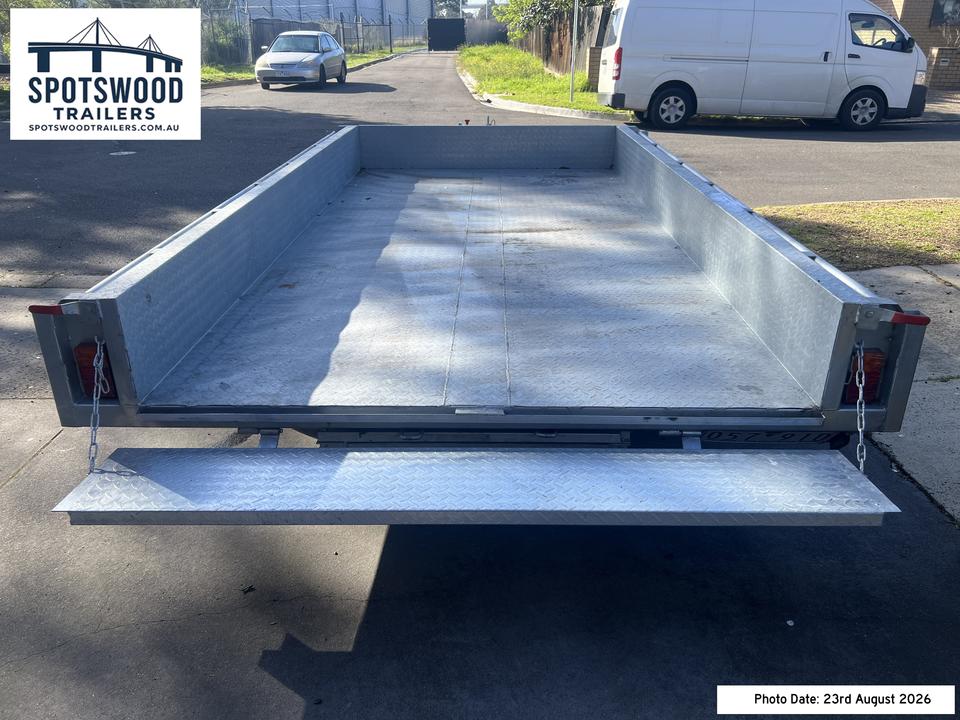 12x6 flat-top trailer with rear tailgate open providing clear access to the loading deck