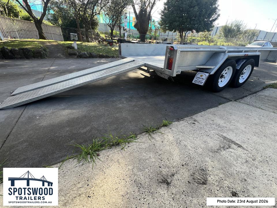 Rear left view of 12x6 flat-top trailer showing checkerplate loading ramp and galvanised deck