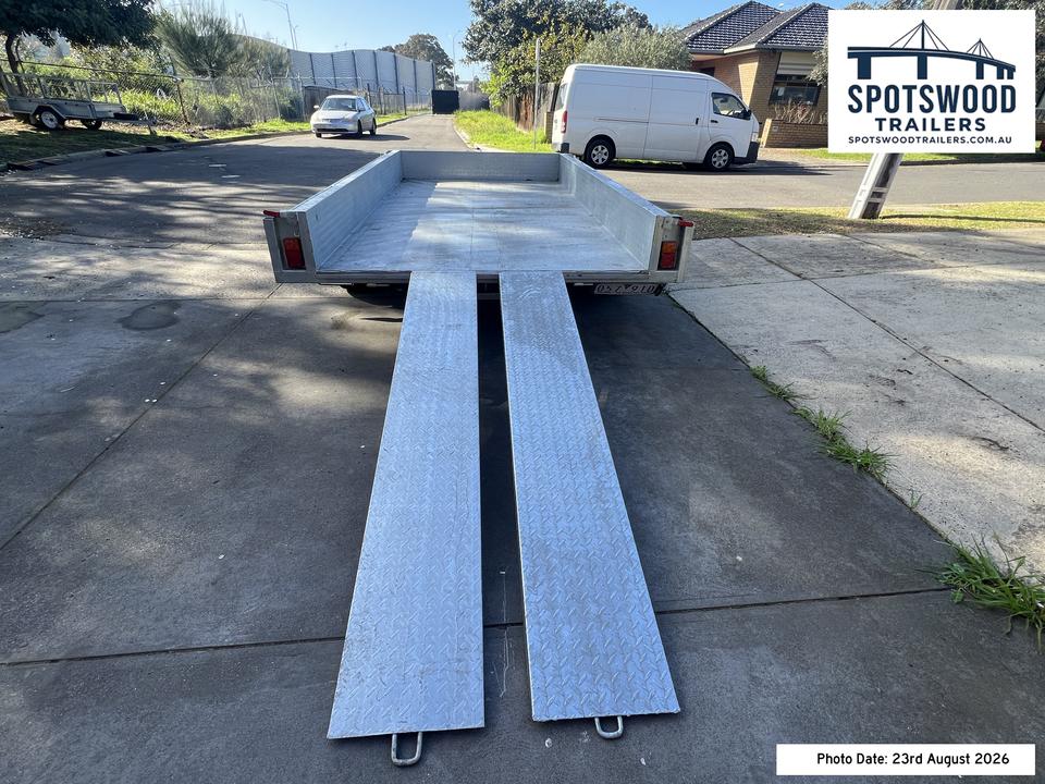 Rear view of 12x6 trailer with twin heavy duty loading ramps deployed for machinery loading