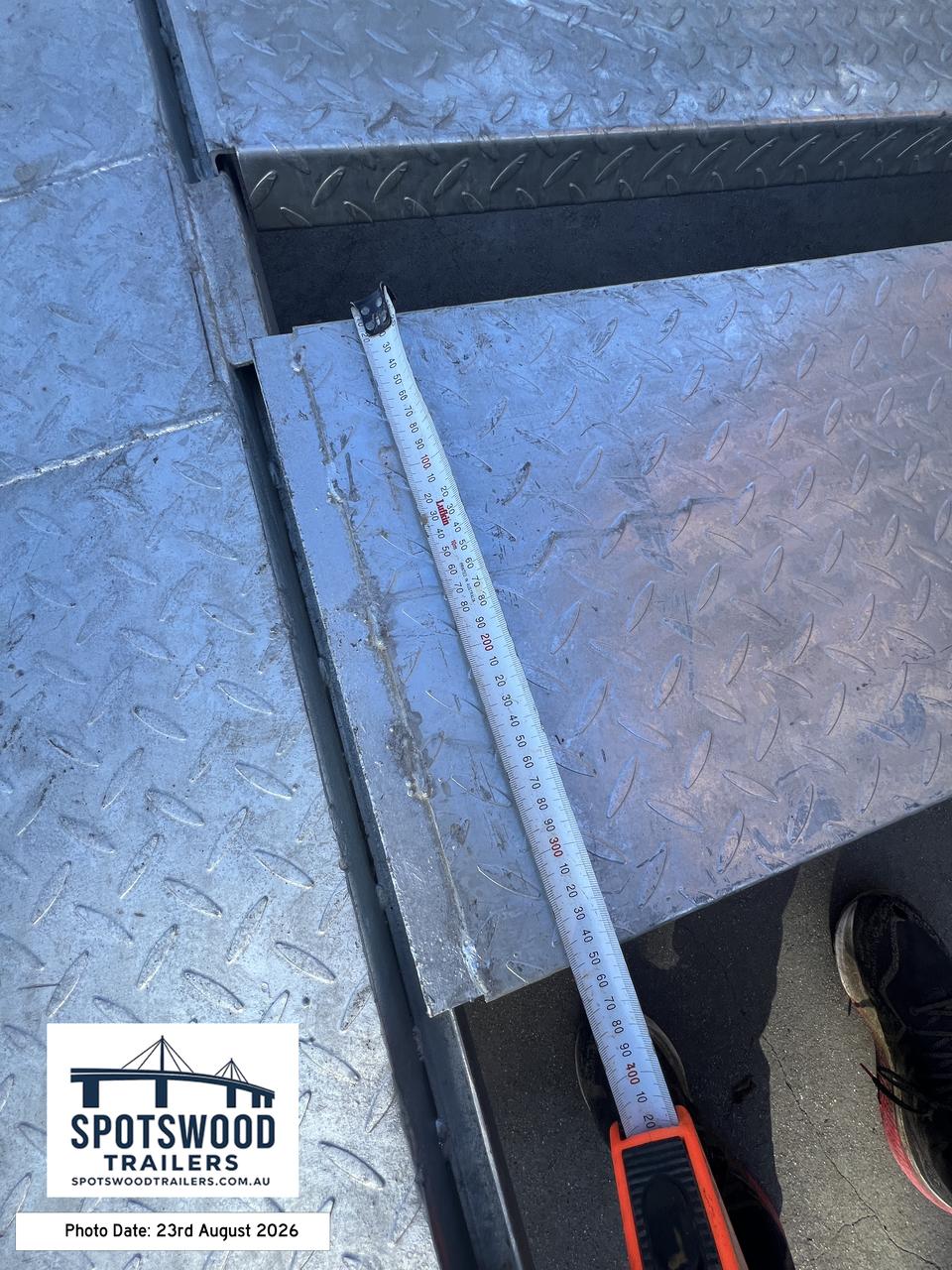 Close-up dimension measurement of The Deckhand heavy duty trailer loading ramp