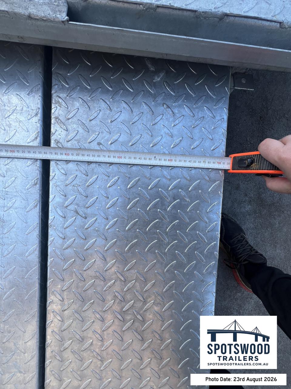 Tape measure showing the width of a heavy duty loading ramp for the 12x6 trailer