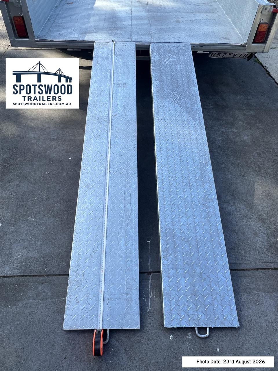 Close-up of twin heavy duty checkerplate loading ramps supplied with The Deckhand trailer