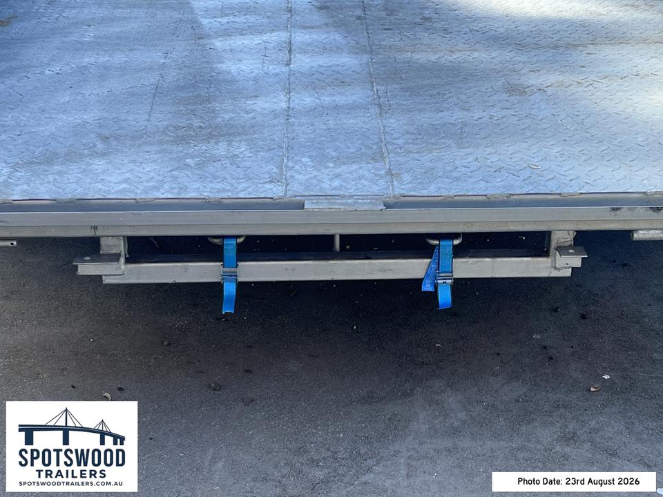 Close-up of loading ramp storage and securing straps underneath The Deckhand trailer